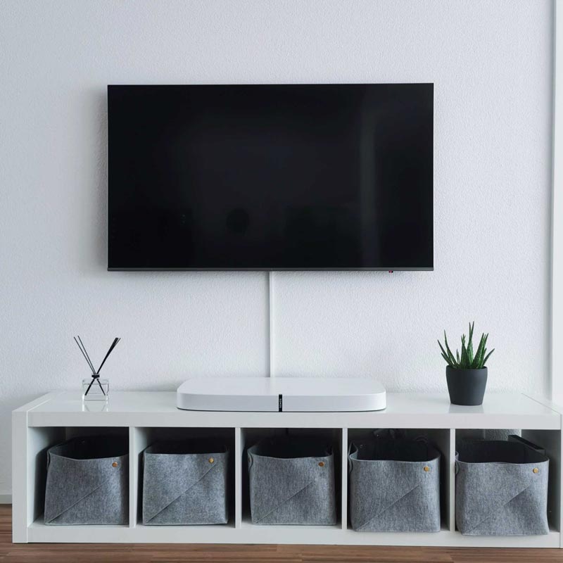 Hide the cables behind a wall mounted TV