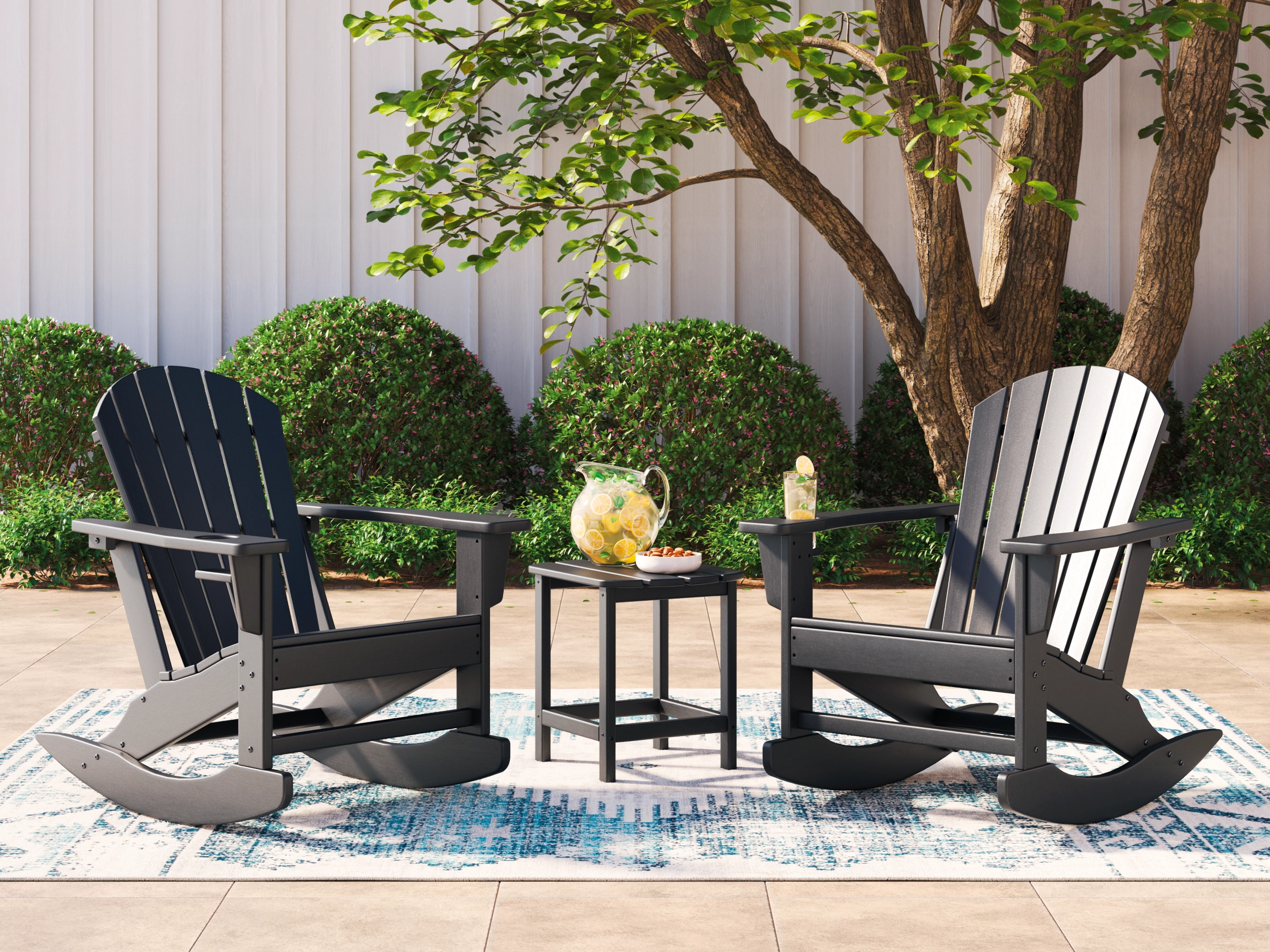 two black rocking adirondack chairs
